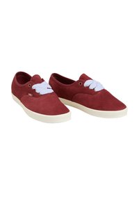 Red suede shoes with white laces and a white rubber sole. Rounded toe shape and minimalistic design. Two eyelets on each side for laces.