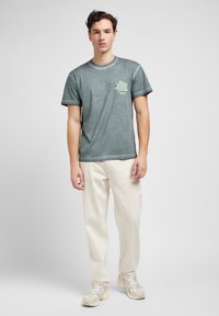 Lee OSCAR - Jeans baggy - off white