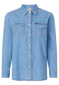 Light blue denim shirt with long sleeves, pointed collar, two chest pockets with chevron stitching, and white snap buttons.