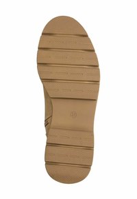 Suela de zapato de goma marrón con un patrón texturizado, que presenta canales horizontales y líneas verticales para el agarre, tamaño marcado como 37.