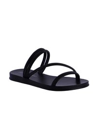 Sandalias planas negras con dos correas de cuentas, que cuentan con una plantilla suave y un diseño minimalista. La suela de goma ofrece flexibilidad y comodidad.