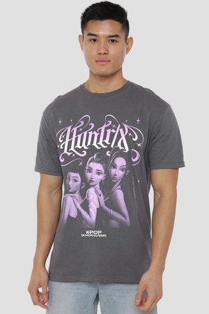 Man wearing gray T-shirt with animated trio of female characters and stylized "Huntix" and "Kpop Demon Hunters" text.