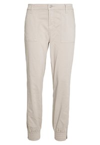 Béžové bavlněné jogger kalhoty s tapered střihem, elastickými manžetami, dvěma předními kapsami, zapínáním na knoflík a hladkou, jemnou texturou.