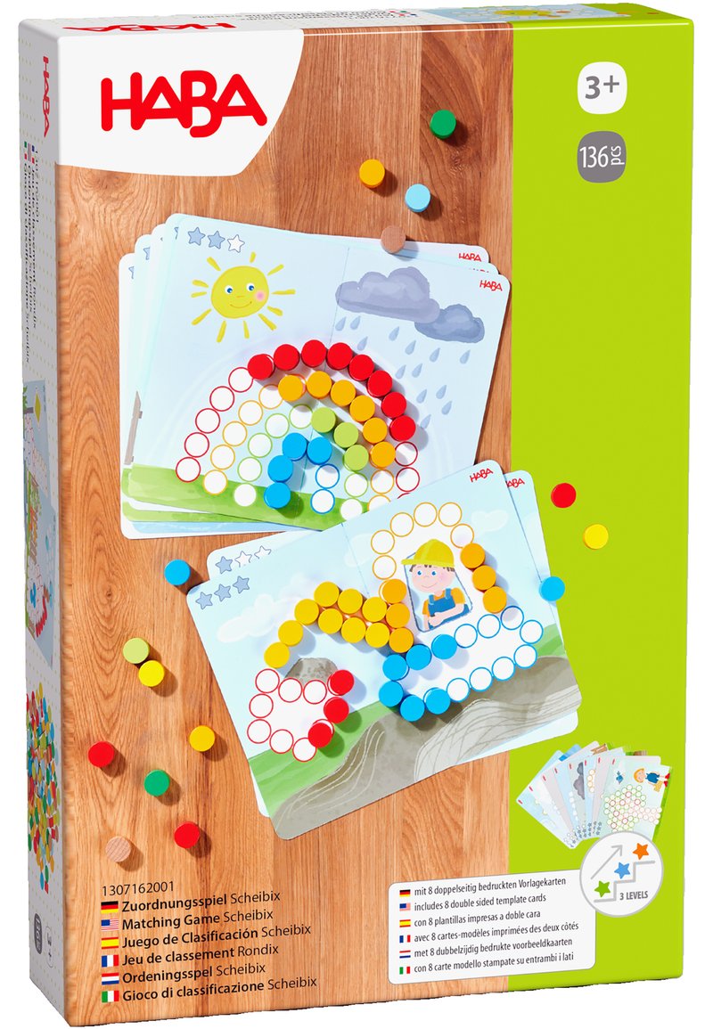 Matching game in a box with colorful round tokens in red, yellow, blue, green, and orange, featuring illustrated templates of a rainbow and sun.
