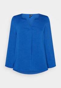 Niebieska bluzka z długim rękawem o luźnym kroju, z dekoltem w kształcie litery V, subtelną teksturą i okrągłym dołem z bocznymi rozcięciami.
