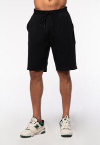 UNISEX  RELAXED FIT - Jogginghose - black