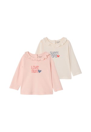 Two long-sleeve toddler shirts with ruffled collars, one pink with "love mum" and blue heart, one cream with "sweet papa" and red heart.
