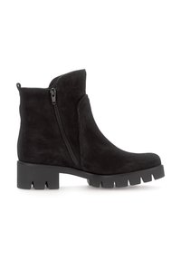 Des bottes chelsea en suede noir présentent une fermeture éclair latérale, un bout arrondi et une semelle en caoutchouc texturé épaisse avec des encoches. Design simpliste avec une finition lisse.