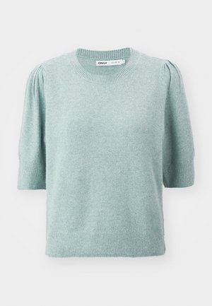 Heled roheline lühikeste varrukatega kampsun, mis on valmistatud pehmest materjalist, ümmarguse kaeluse ja peene puhviga õlgade kujundusega. Ribakujulised mansetid ja alumine äär.