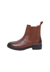 Brązowe skórzane botki typu Chelsea z elastycznymi panelami bocznymi i pętelką. Okrągły nos i niski czarny obcas. Gładkie wykończenie z teksturowanymi akcentami.