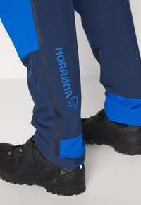 Norrøna FJØRÅ PANTS - Calças de ciclismo - indigo night/olympian blue