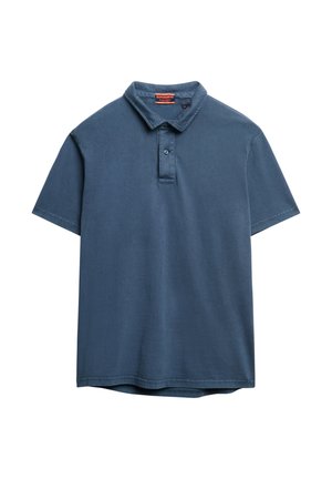 Polo a maniche corte in cotone blu scuro, con una texture morbida, colletto con due bottoni e orlo dritto senza fantasie.