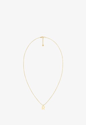 Zlato-tonirana ogrlica ima nežno verigo in izstopajoči obesek v obliki črke "R". Prilagodljiva dolžina z zaponko na jermenu in podaljškom.