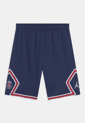Granatowe szorty sportowe z elastycznym pasem, białymi i czerwonymi akcentami oraz logo Paris Saint-Germain i Jordana na każdej nogawce.