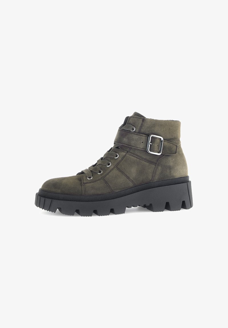 Olive green suede ankle boots with black chunky rubber sole, lace-up front, side buckle accent, and padded collar.