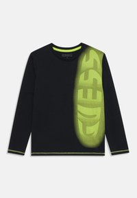 Svart langermet t-skjorte med neon grønn "GUESS" logo og detaljer. Har rund hals og kontraststing. Laget av myk bomull.