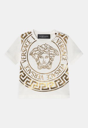 T-shirt blanc pour tout-petit avec logo Versace Medusa doré et motif clé grecque, avec deux boutons-pression aux épaules.