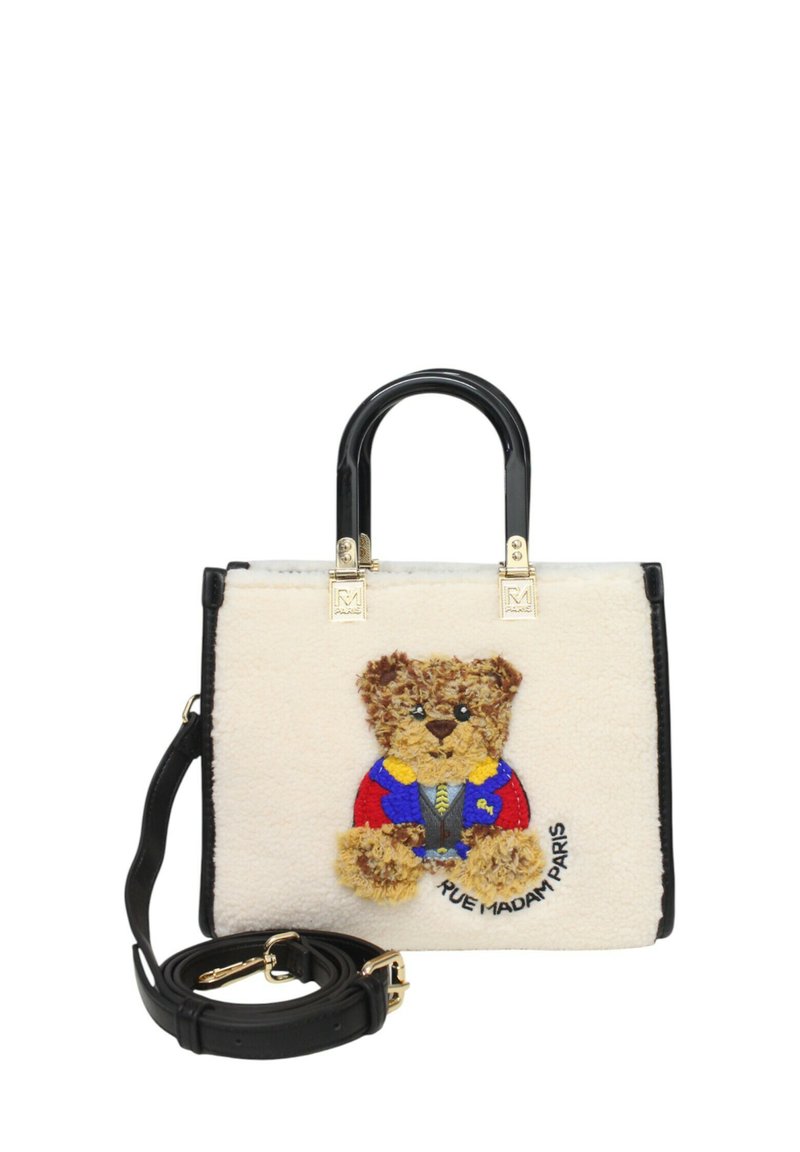 Valkoinen tekoturkishandbag mustilla yksityiskohdilla, jossa on värikkäissä vaatteissa oleva karhun teddy -kirjonta ja irrotettava musta olkahihna.
