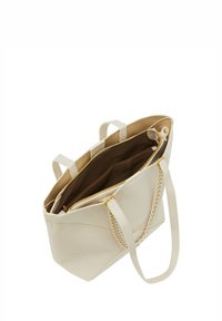 Beige læder tote bag med en struktureret overflade, dobbelte hanke og lynlåslukning. Indvendigt har den en brun foret og flere lommer.