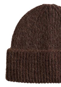 Brown knitted beanie made of wool, featuring a ribbed texture and fold-over cuff. The material has a fuzzy appearance with light color variations.