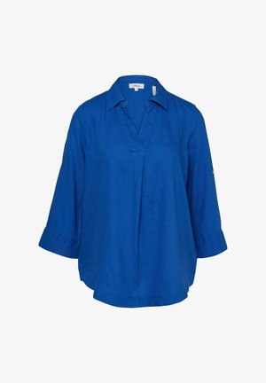 Niebieska bluzka z długimi rękawami, dekoltem w serek i rękawami o długości 3/4 zakończonymi delikatnymi falbankami.