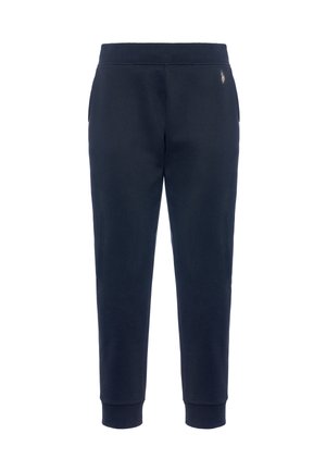 Pantaloni jogger in cotone blu navy con una vestibilità affusolata, dotati di tasche laterali e cintura a coste. Dettaglio del logo discreto sulla parte superiore della gamba sinistra.