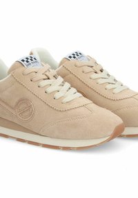 Beige suede sneakers with cream laces, padded collar, and rubber sole. Features logo embroidery and checkered label on the tongue.