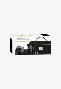 Set Shiseido Future Solution LX in un elegante astuccio nero. Include un barattolo rotondo, due tubetti e un barattolo piccolo. Accenti dorati e design strutturato.