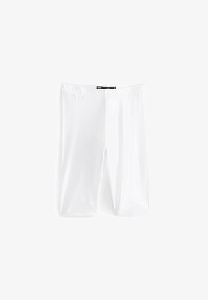 Leggings bianchi realizzati in tessuto elastico, con un cinturino in vita elastico e una superficie liscia. Nessun motivo o dettaglio aggiuntivo visibile.