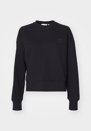 Black cropped sweatshirt with long sleeves, crew neck, and ribbed cuffs. Features a small black logo patch on the left chest. Soft texture.