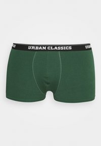 Zelene boksarice iz mehkega materiala, z črnim elastičnim pasom, na katerem je v belem napisan "URBAN CLASSICS". Standardna velikost s podrobnostmi šivanja.