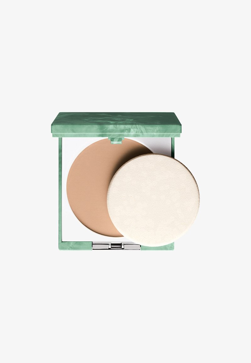 Kompaktpudder i grønt marmoreret etui. Indeholder et lysebrunt pudder med ribbet tekstur og en rund, blød hvid applikatorpuf.