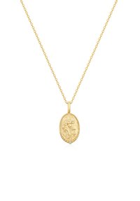 Auksinės spalvos vėrinys su ovalo formos pakabuku, papuoštu gėlių raižiniu, papildytu mažu, įmontuotu akmeniu. Grandinėlės dizainas.