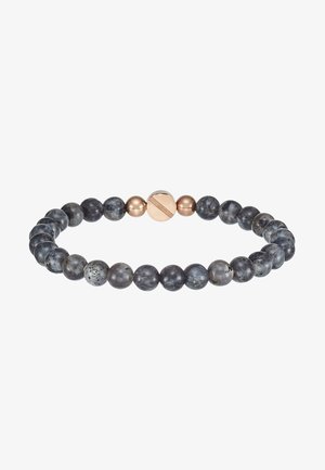 Armband aus Lavasteinperlen in verschiedenen Grautönen, mit einem glatten, runden Design und einem zentralen magnetischen Verschluss in metallic-goldener Optik.