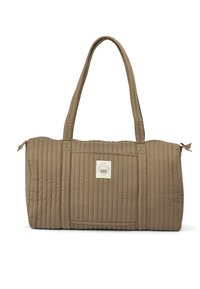 Bezs krāsas sūti soma ar divām gariem rokturiem, taisnstūrveida formu, šūtu faktūru un nelielu logotipa uzlīmi priekšpusē.