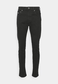 Svarta denimjeans med slim fit, femfickorsdesign och metalldetaljer. Har en minimalistisk stil och en klassisk knappstängning.