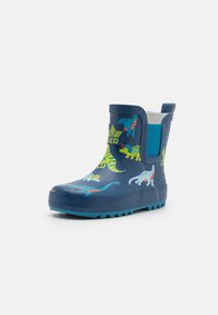 Blå gummistøvler med dinosaurmønstre, teksturert såle og elastisk panel på siden for enkel påkledning. Har en opphengsdrakt for bekvemmelighet.