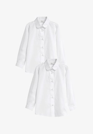 Două cămăși albe simple, cu mâneci lungi și nasturi, guler rotunjit, așezate pe o suprafață plană, concepute pentru uniforme școlare.