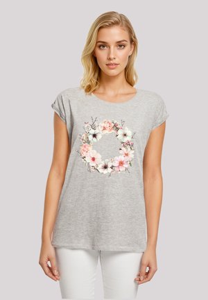 Gray short-sleeve T-shirt featuring a floral print in pink and white on the front, with a relaxed fit and soft texture.
