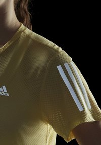 adidas Performance OWN THE RUN COOLER - Sport T-Shirt - yellow