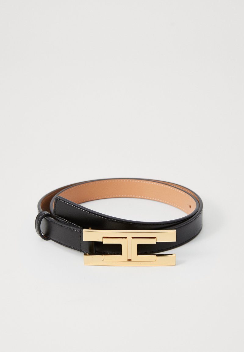 Black leather belt coiled with a rectangular gold buckle featuring a geometric cutout design on a white background.