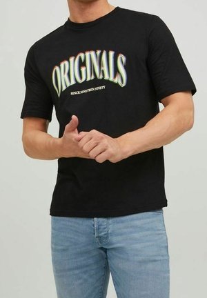 Black cotton t-shirt featuring the word "ORIGINALS" in multicolored, curved text with a white tagline beneath it. Short sleeves, crew neckline.