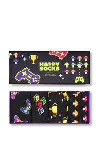 Coffret cadeau de gamer comprenant six chaussettes colorées ornées de designs pixélisés de manettes de jeu, de trophées et de champignons sur un fond noir.