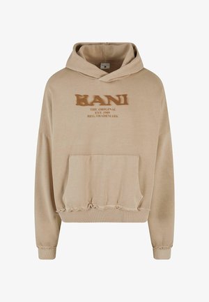 Beige capuchontrui met een voorzak, voorzien van versleten zoom en bedrukt merktekst in bruin. Zacht katoenmateriaal.