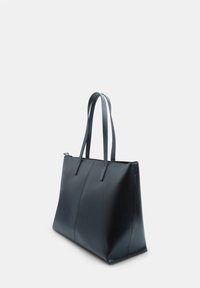 Black leather tote bag with two long handles, rectangular shape, smooth texture, and seam detailing on the front panel.