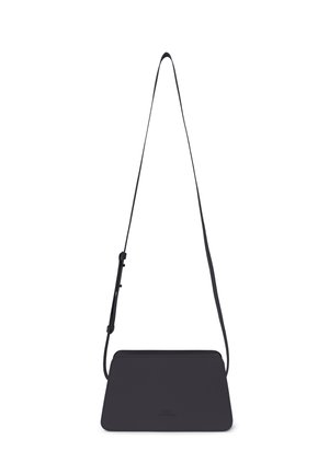 Black rectangular crossbody bag with adjustable strap and minimalist design, hanging against a white background.
