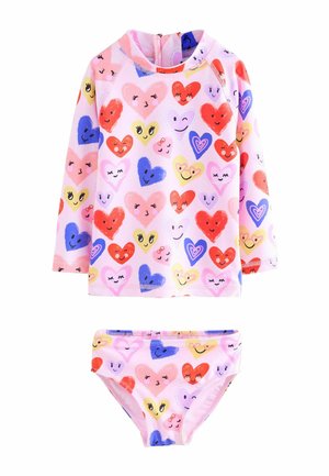 Long-sleeve pink swimsuit set featuring a top and matching bikini bottom. Design includes multicolored heart patterns and smiley faces.