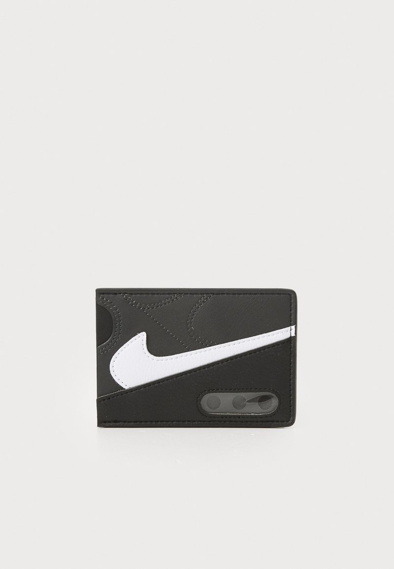 Black leather wallet with a white Nike logo, featuring embossed details, contrasting textures, and a transparent card slot on the side.