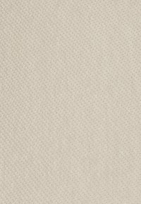 Beige fabric background with coarse knit texture and a partially visible orange pencil horizontally aligned near the top edge.