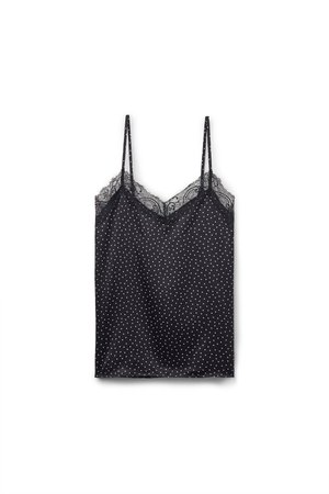 Camiseta negra sin mangas con lunares blancos, tirantes finos y un borde de encaje en el escote. Tejido suave con un corte holgado.